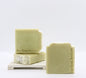 3 bars of handmade key lime coconut soap are displayed on a white surface